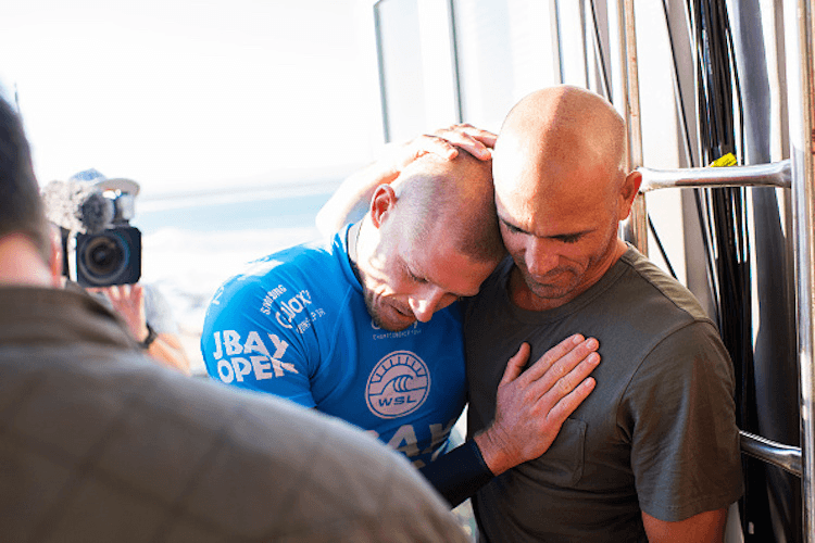 Mick Fanning is consoled by Kelly Slater after being attacked and surviving a shark attack during the Final of the JBay Open.  (Photo by Kirstin Scholtz/WSL via Getty Images)