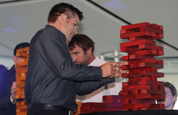 Richie McCaw playing Jenga at the 2011 Super Rugby season launch. (Photo: Getty Images)