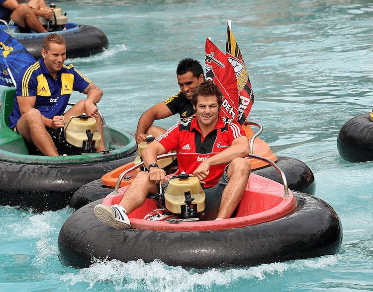 Richie McCaw caning it on a bumper boat in 2012.  (Photo by Geoff Dale/Getty Images)