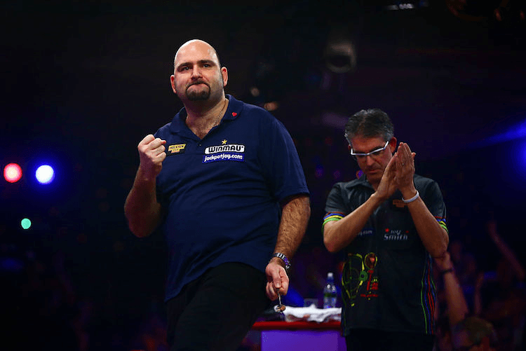 FRIMLEY, ENGLAND - JANUARY 10:  Scott Waites of England celebrates winning the Men's final match against Jeff Smith of Canada during Day Nine of the BDO Lakeside World Professional Darts Championships at The Lakeside Country Club on January 10, 2016 in Frimley, England.  (Photo by Jordan Mansfield/Getty Images)