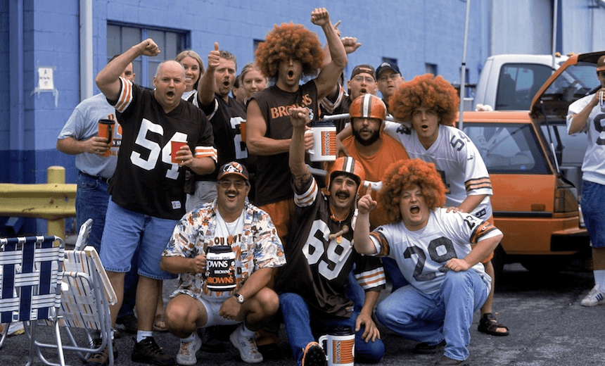 CLEVELAND - SEPTEMBER 15: Tailgating fans of the Cleveland Browns pose for a group portrait outside of the stadium before the NFL game against the Cincinnati Bengals on September 15, 2002 at Cleveland Browns Stadium in Cleveland, Ohio. The Browns won 20-7. (Photo by Paul Spinelli/Getty Images)
