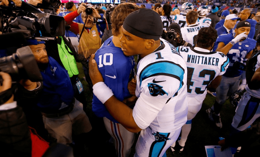 EAST RUTHERFORD, NJ - DECEMBER 20: Cam Newton #1 of the Carolina Panthers hugs Eli Manning #10 of the New York Giants after their game at MetLife Stadium on December 20, 2015 in East Rutherford, New Jersey. The Carolina Panthers defeated the New York Giants with a score of 38 to 35. (Photo by Michael Reaves/Getty Images)