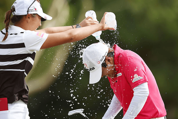 Lydia Ko and Haru Nomura in scenes probably reminiscent of the 1991 MTV Music Awards.  (Photo by Morne de Klerk/Getty Images)