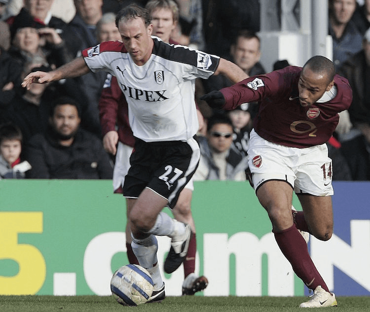 LONDON - MARCH 04:  Simon Elliot of Fulham competes with Thierry Henry of Arsenal during the Barclays Premiership match between Fulham and Arsenal at Craven Cottage on Mach 04, 2006 in London, England.  (Photo by Phil Cole/Getty Images)
