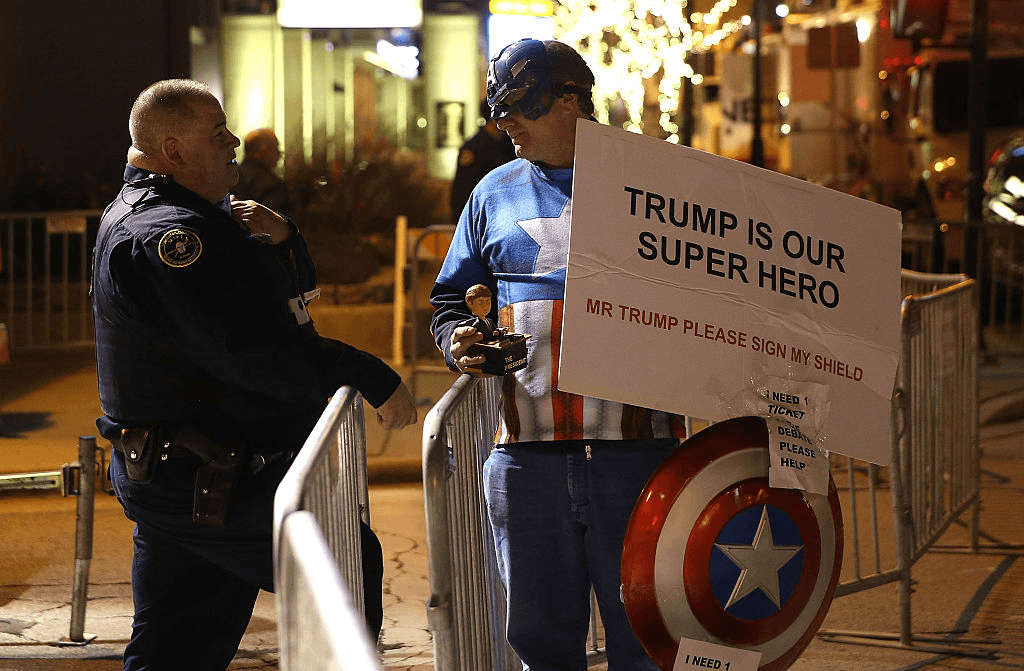 MILWAUKEE, WI - NOVEMBER 10:  A supporter of republican presidential candidate Donald Trump wears a Captain America outfit outside of the Republican Presidential Debate sponsored by Fox Business and the Wall Street Journal at the Milwaukee Theatre on November 10, 2015 in Milwaukee, Wisconsin. The fourth Republican debate is held in two parts, one main debate for the top eight candidates, and another for four other candidates lower in the current polls.  (Photo by Justin Sullivan/Getty Images)