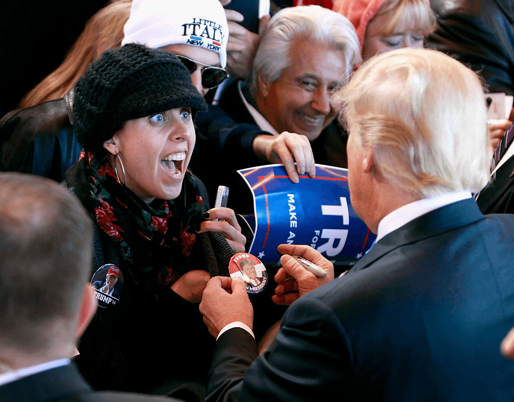 MESA, AZ - DECEMBER 16:  A campaign supporter reacts as Republican presidential candidate Donald Trump signs her button during a campaign event at the International Air Response facility on December 16, 2015 in Mesa, Arizona. Trump is in Arizona the day after the Republican Presidential Debate hosted by CNN in Las Vegas, Nevada.  (Photo by Ralph Freso/Getty Images)