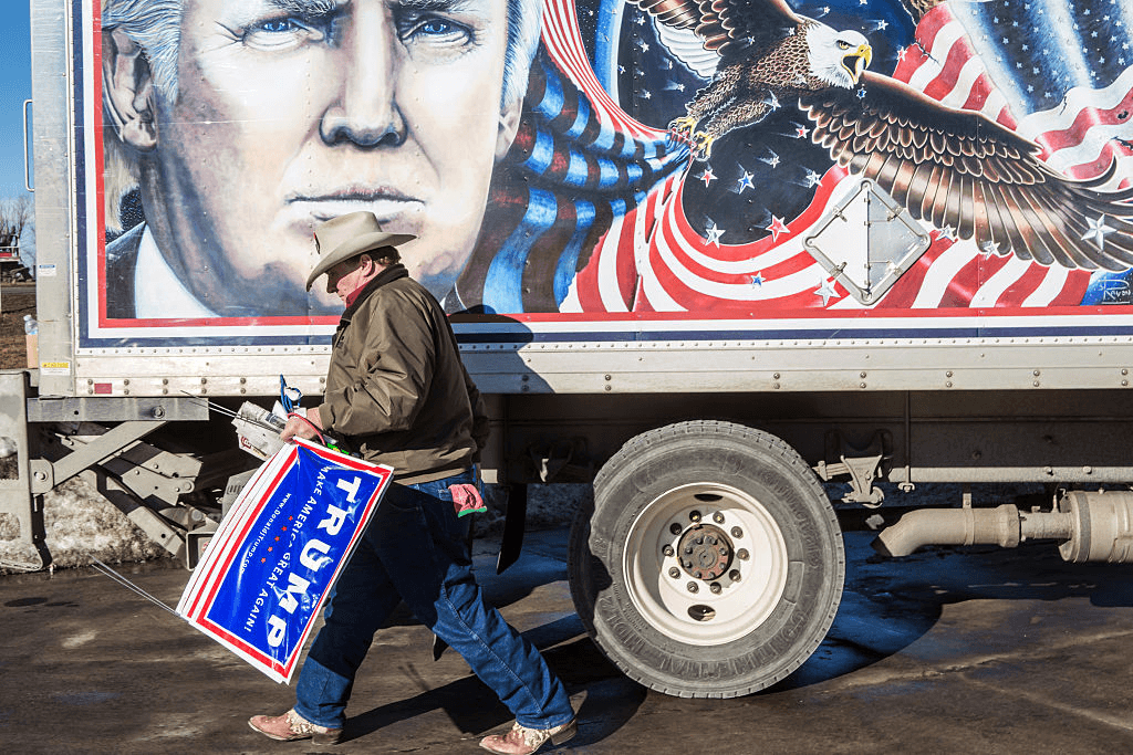 DES MOINES, IA - JANUARY 28: Kraig Moss, a supporter of Republican presidential candidate Donald Trump, outside a truck with a Trump painting in which he is touring Iowa on January 28, 2016 in Des Moines, Iowa. The Democratic and Republican Iowa Caucuses, the first step in nominating a presidential candidate from each party, will take place on February 1. (Photo by Brendan Hoffman/Getty Images)