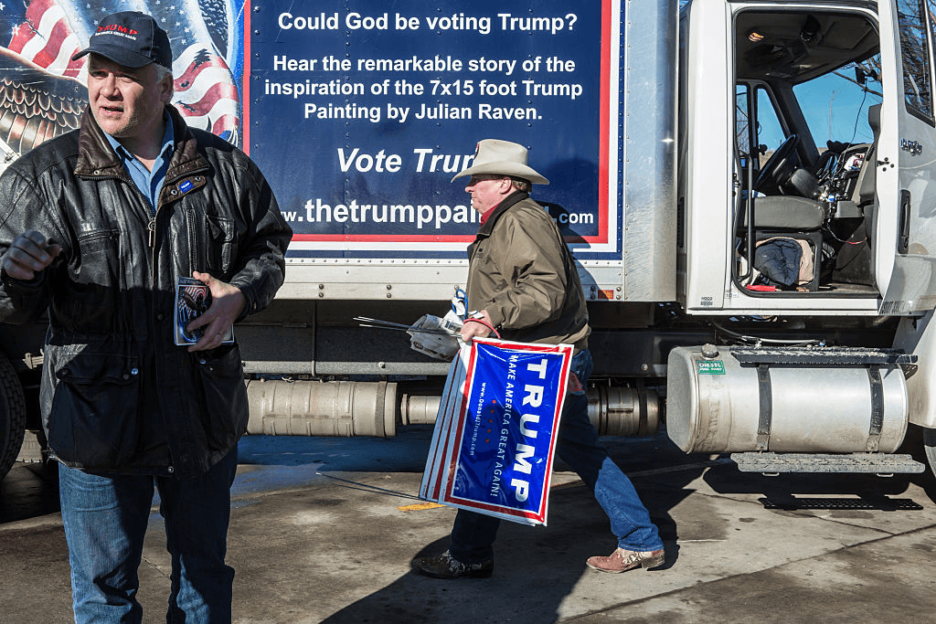 DES MOINES, IA - JANUARY 28: Julian Raven (L) and Kraig Moss, both supporters of Republican presidential candidate Donald Trump, outside a truck with a Trump painting in which they are touring Iowa on January 28, 2016 in Des Moines, Iowa. The Democratic and Republican Iowa Caucuses, the first step in nominating a presidential candidate from each party, will take place on February 1. (Photo by Brendan Hoffman/Getty Images) *** Local Caption *** Kraig Moss;Julian Raven