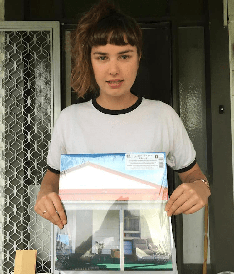Edrosa holding an LP of Hauora, six years in the making. Image: Supplied