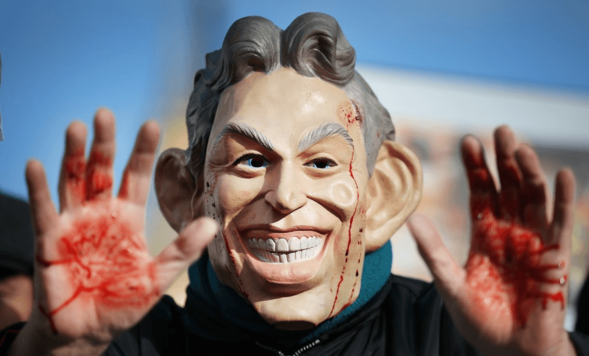 Members of the Stop the War Coalition protest near Parliament on January 29, 2015 in London, England. Members of Parliament are today debating delays to the official inquiry into the Iraq War. The Chilcot inquiry began in 2009 and says it will not give it’s final report until after the general election. 
