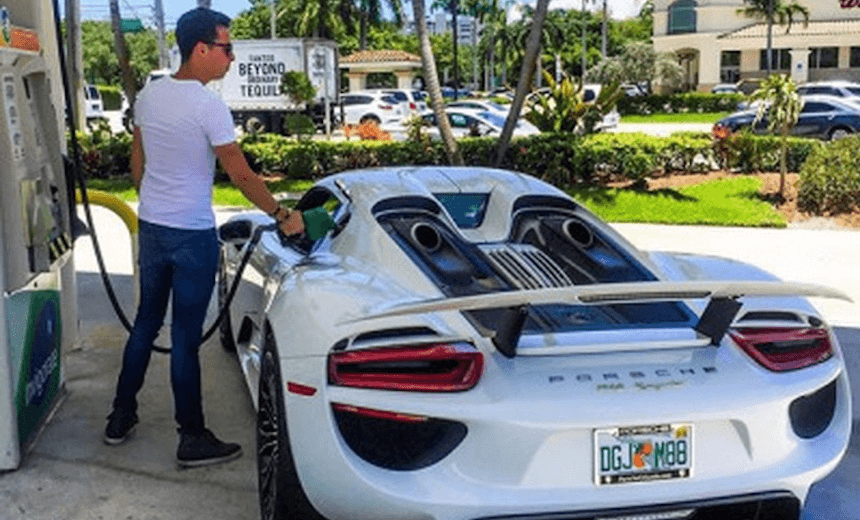 A YOUNG AUCKLAND HOUSE HUNTER FILLS UP HIS CAR