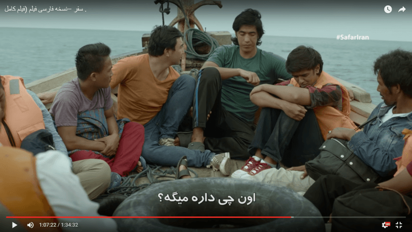 Najib (green shirt) comforts a sick Belal (red and white sneakers). 