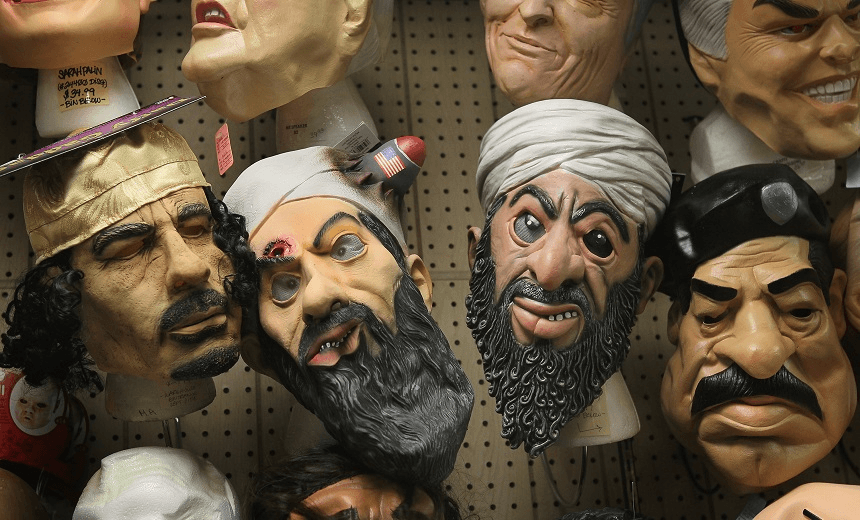 CHICAGO, IL – OCTOBER 28:  Halloween masks of Muammar Gaddafi, Osama bin Laden, and Saddam Hussein are offered for sale at Fantasy Costumes on October 28, 2011 in Chicago, Illinois.  The store, which had long lines at the registers at 4 AM this morning, is open around the clock through Halloween to help keep up with customer demand. Retailers nationwide are expecting record sales for Halloween merchandise this year with shoppers spending close to $7 billion dollars to celebrate the holiday.  (Photo by Scott Olson/Getty Images) 
