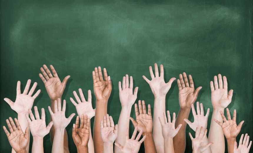 Multiethnic Group of Hands Raised with Blackboard 
