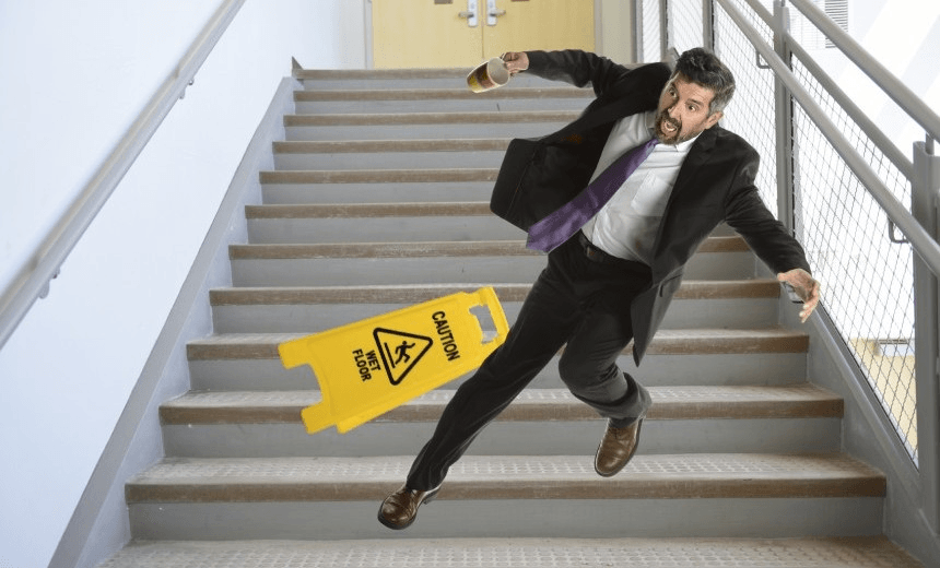 Mature Hispanic businessman falling down the stairs 
