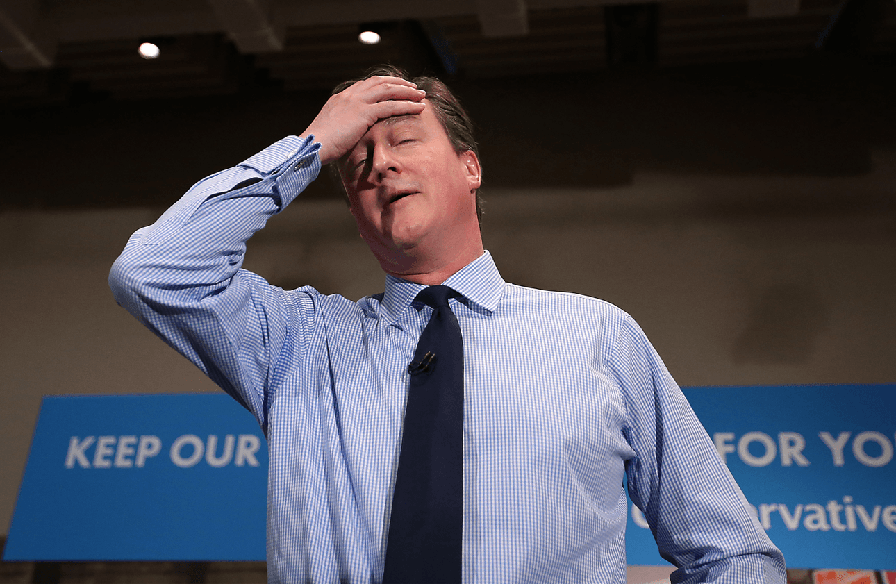 LONDON, ENGLAND – APRIL 27:  Prime Minister David Cameron wipes away some sweat as he speaks to business leaders on April 27, 2015 in London, England. Mr Cameron has started the fifth week of the general election campaign with a passionate speech in the heart of the City of London financial district.  (Photo by Peter Macdiarmid/Getty Images) 
