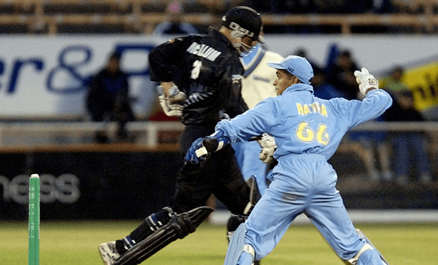 India’s wicketkeeper Ratra throws the ball to the other end as Black Max batsman Brendon McCallum runs past during the Super Max cricket international at Jade Stadium,Wednesday.  (Photo by Simon Baker/Getty Images) 
