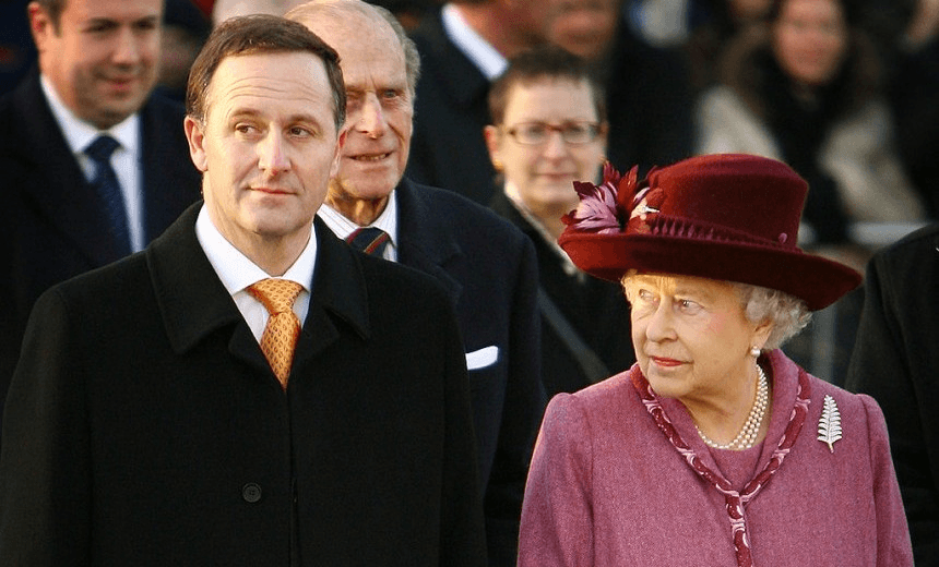 LONDON – NOVEMBER 25:  Queen Elizabeth II looks at New Zealand Prime Minister John Key on November 25, 2008 in London. The Queen visited a New Zealand tourism exhibition housed in a giant inflatable rugby ball near London’s Tower Bridge.  (Photo by Peter Macdiarmid/Getty Images) 
