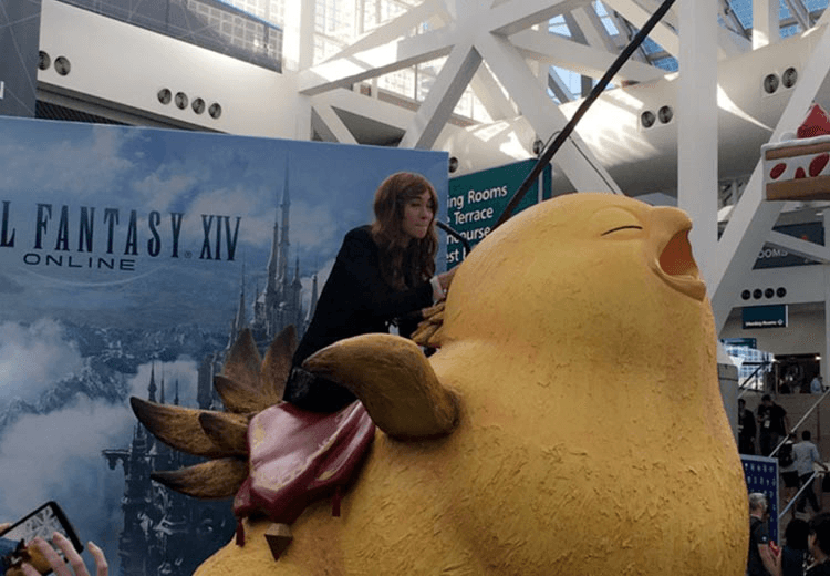 A woman riding a giant infantile chicken
