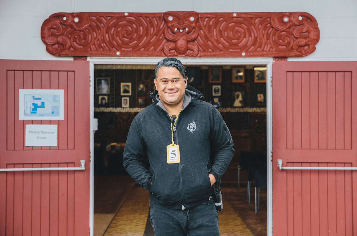 Johnboi stands in front of his home, Te Puea (Photo credit: Qiane Matata-Sipu)