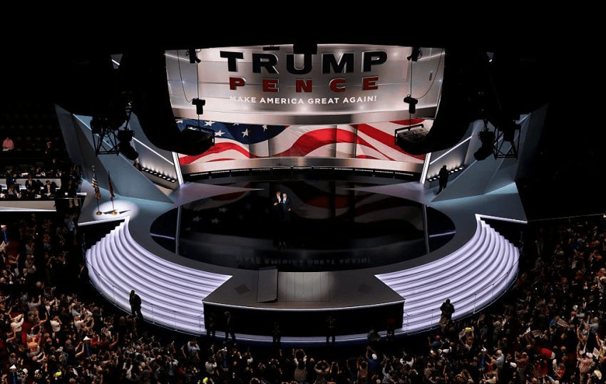 CLEVELAND, OH - JULY 20: Republican presidential candidate Donald Trump stands with Republican vice presidential candidate Mike Pence after he delivered a speech on the third day of the Republican National Convention on July 20, 2016 at the Quicken Loans Arena in Cleveland, Ohio. Republican presidential candidate Donald Trump received the number of votes needed to secure the party's nomination. An estimated 50,000 people are expected in Cleveland, including hundreds of protesters and members of the media. The four-day Republican National Convention kicked off on July 18. (Photo by Chip Somodevilla/Getty Images)