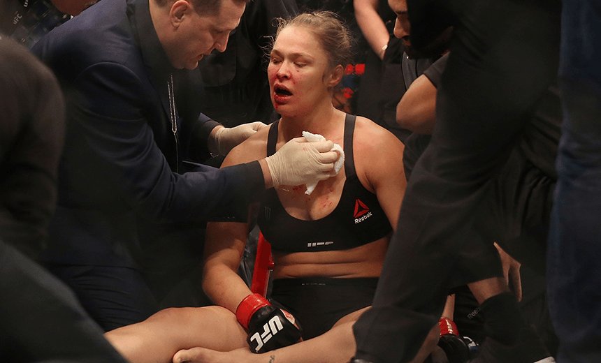 MELBOURNE, AUSTRALIA – NOVEMBER 15:  Ronda Rousey of the United States receives medical treatment after being defeated by Holly Holm of the United States in their UFC women’s bantamweight championship bout during the UFC 193 event at Etihad Stadium on November 15, 2015 in Melbourne, Australia.  (Photo by Quinn Rooney/Getty Images) 
