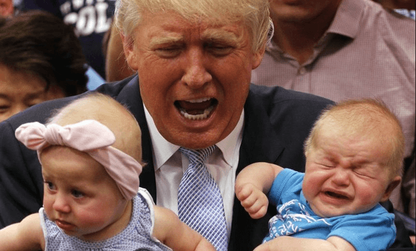 Republican presidential nominee Donald Trump reacts to the cries of three-month-old Kellen Campbell, of Denver, right, while holding six-month-old Evelyn Keane, of Castel Rock, Colo., after Trump’s speech at the Gallogly Event Center on the campus of the University of Colorado on July 29, 2016. (Photo by Joe Mahoney/Getty Images) 
