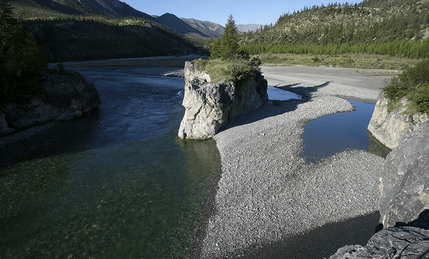 A rocky island in the river. River Omulevka. Magadan Region. Russia.