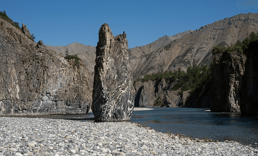 Own a rock in the middle of the riverbed. River Omulevka. Yakutia. Russia. 
