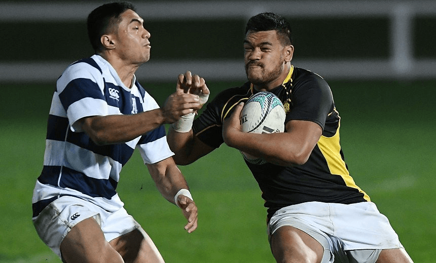LOSI FILIPO (LEFT) FENDS OFF TJ VAEGA OF AUCKLAND. PHOTO: GETTY 

