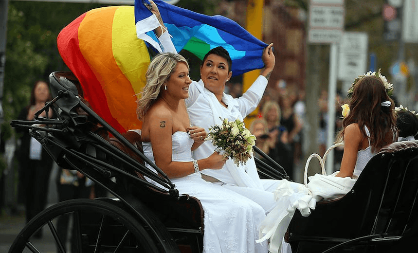 Natasha Vitali and Melissa Ray leave the Auckland Unitary Church on a horse drawn cart following their wedding on August 19, 2013 in Auckland, New Zealand. New Zealand passed a bill to legalize same-sex marriage as of August 19, 2013. (Photo: Phil Walter/Getty) 
