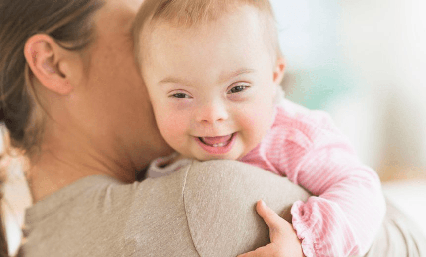 A mother holding a baby girl with Down’s Syndrome. Photo: JGI/Tom Grill 
