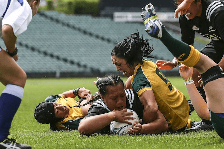 Toka Natua scores a try. (Photo by Simon Watts/Getty Images)