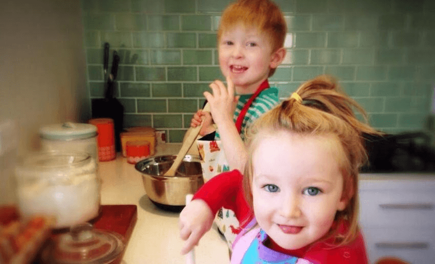 Two of Stacey's children hard at work in the kitchen