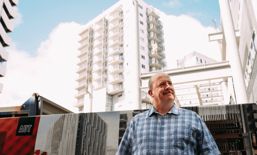 The author, in front of some houses. 
