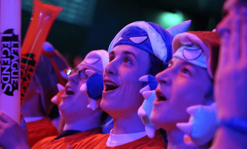 Fans react as international teams play during the tournament of the computer game “League of Legends” on May 8, 2014 in Paris. Launched late in 2009 by American video game publisher Riot Games, “League of Legends” is a game in which teams of five players compete in a virtual arena, killing each other using different powers and equipments in the goal to capture the enemy base. According to Riot Games, more than 67 million people play each month, with peaks of more than 7.5 million concurrent players at peak hours. The game will last four days starting today. AFP PHOTO / LIONEL BONAVENTURE        (Photo credit should read LIONEL BONAVENTURE/AFP/Getty Images) 
