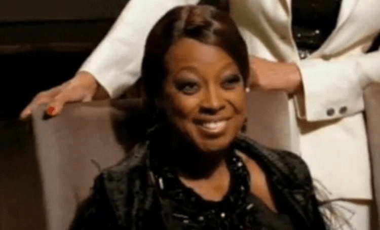 Star Jones smiling through pure hell. 