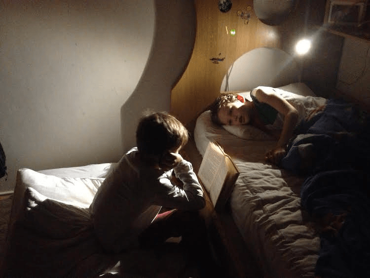 Cormac reading by lamplight