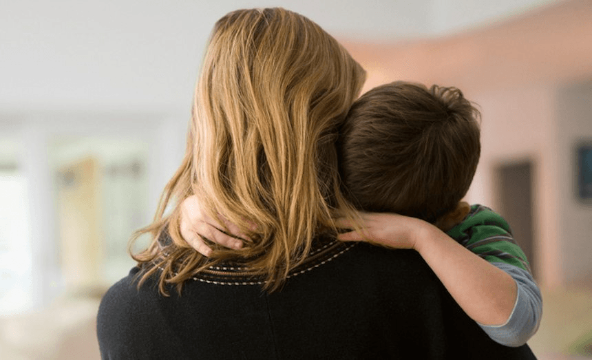 Caucasian mother comforting son