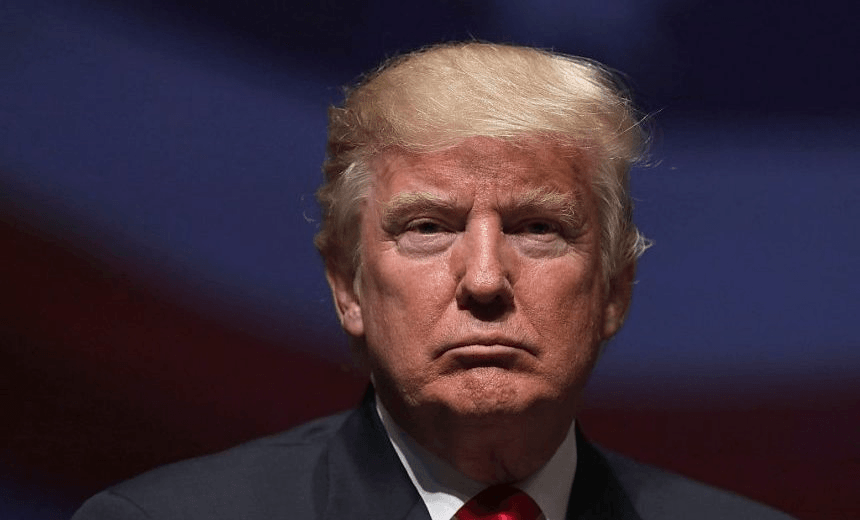 VIRGINIA BEACH, VA – SEPTEMBER 06:  Republican presidential nominee Donald Trump pauses during a campaign event September 6, 2016 in Virginia Beach, Virginia. Trump participated in a discussion with retired Army Lieutenant General Michael Flynn.  (Photo by Alex Wong/Getty Images) 
