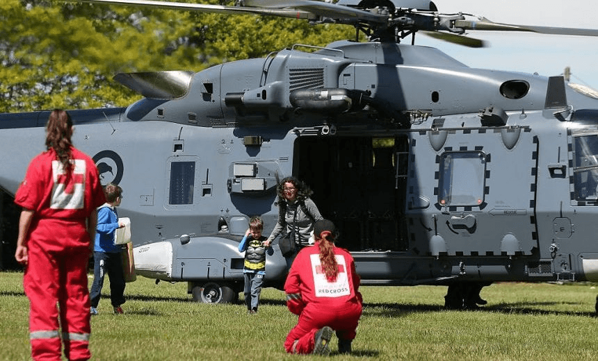 CHRISTCHURCH, NEW ZEALAND – NOVEMBER 15:  Tourists trapped by the Kaikoura earthquakes arrive by military helicopters at Woodend School grounds on November 15, 2016 in Christchurch, New Zealand. Aftershocks have rocked regions of New Zealand following a 7.8-magnitude earthquake that killed two people yesterday.  (Photo by Martin Hunter/Getty Images) 
