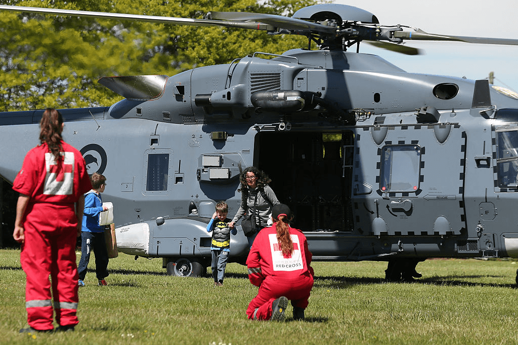 CHRISTCHURCH, NEW ZEALAND - NOVEMBER 15: Tourists trapped by the Kaikoura earthquakes arrive by military helicopters at Woodend School grounds on November 15, 2016 in Christchurch, New Zealand. Aftershocks have rocked regions of New Zealand following a 7.8-magnitude earthquake that killed two people yesterday. (Photo by Martin Hunter/Getty Images)