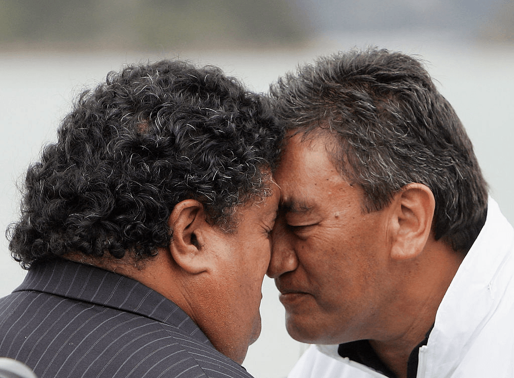 WAITANGI, NEW ZEALAND - FEBRUARY 05: Maori Party MP Hone Harawira (R) hongis with Labour Party MP Parekura Horomia (L) outside the Te Tii Marae on the eve of Waitangi Day celebrations February 05, 2007 in Waitangi, New Zealand. Waitangi Day is a public holiday celebrated on February 6th to commemorate the signing of the Treaty of Waitangi between the British and the Maori people. (Photo by Phil Walter/Getty Images)