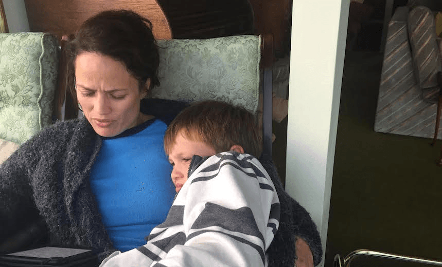Nadine Millar reading with her son Cormac 
