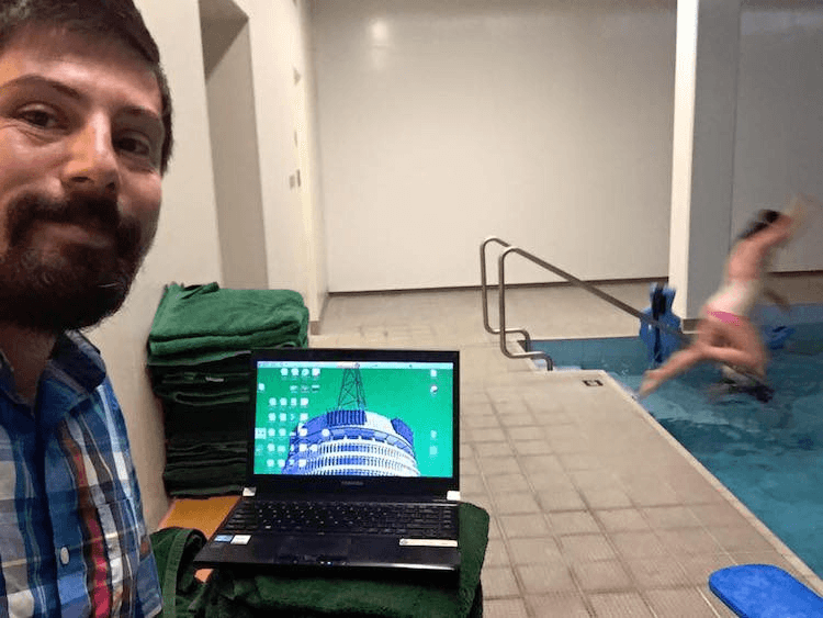 Working hard at his towel-desk, at the parliamentary swimming pool