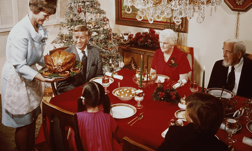 A mother bringing a large turkey to the table for Christmas dinner, circa 1965. (Photo by L. Willinger/FPG/Hulton Archive/Getty Images) 
