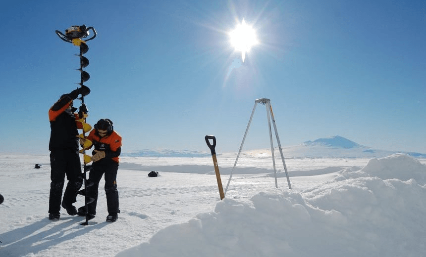 Brett Grant (NIWA) and Natalie Robinson drilling sea ice. Credit Gabby OConnor