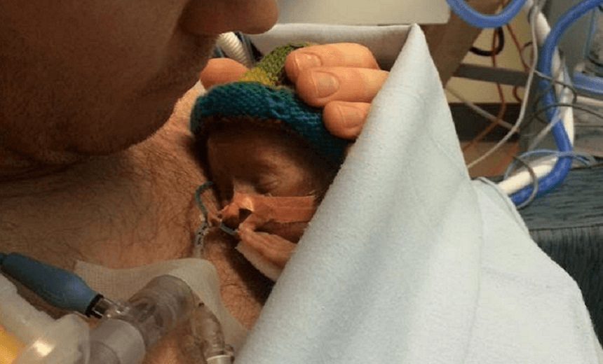 Baby Charlie's last cuddle with his father.