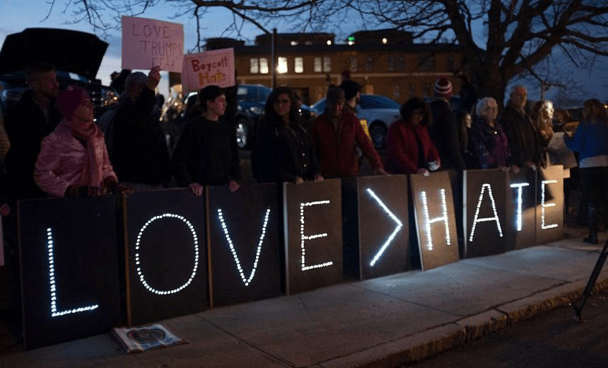 PORTSMOUTH, NH – DECEMBER 10: Protesters stand outside the Sheraton Portsmouth Harborside Hotel where Republican Presidential candidate Donald Trump is due to speak at the New England Police Benevolent Association Meeting December 10, 2015 in Portsmouth, New Hampshire. Trump recently called for a ban on all Muslims entering the United States until the vetting process could be improved. (Photo by Darren McCollester/Getty Images) 

