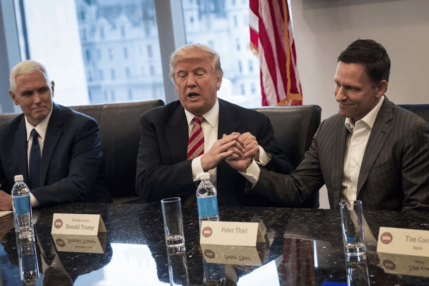 NEW YORK, NY - DECEMBER 14: (L to R) Vice President-elect Mike Pence looks on as President-elect Donald Trump shakes the hand of Peter Thiel during a meeting with technology executives at Trump Tower, December 14, 2016 in New York City. This is the first major meeting between President-elect Trump and technology industry leaders. (Photo by Drew Angerer/Getty Images)
